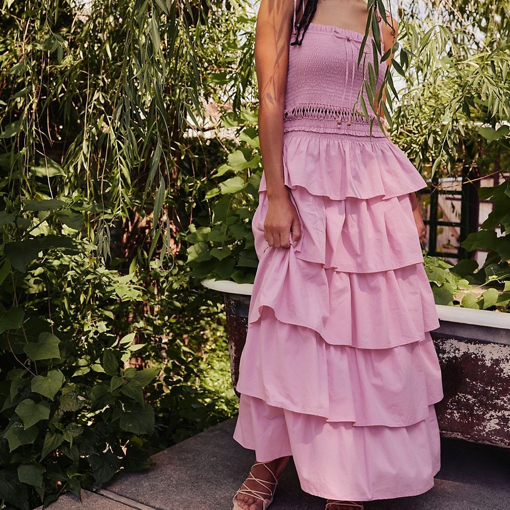 Beautiful ruffles dress in xs by Free People never worn with tags!